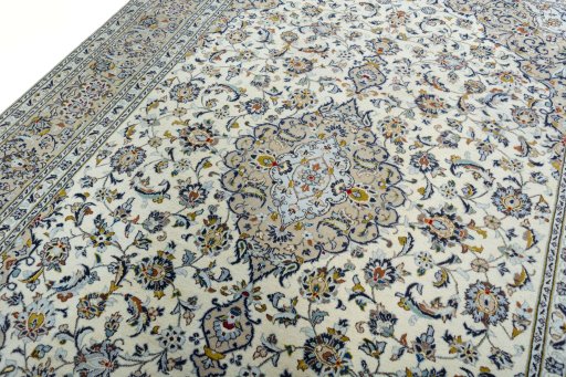 Backside of handmade 2000s Kashan rug showing knot structure and weave density