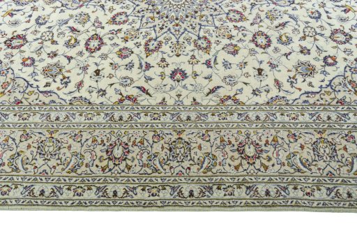 Corner detail of 2000s Kashan rug showing border pattern and Wool pile