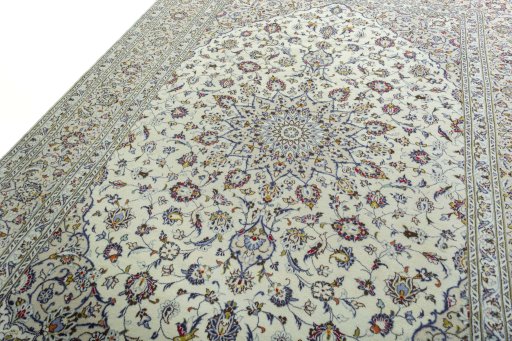 Backside of handmade 2000s Kashan rug showing knot structure and weave density