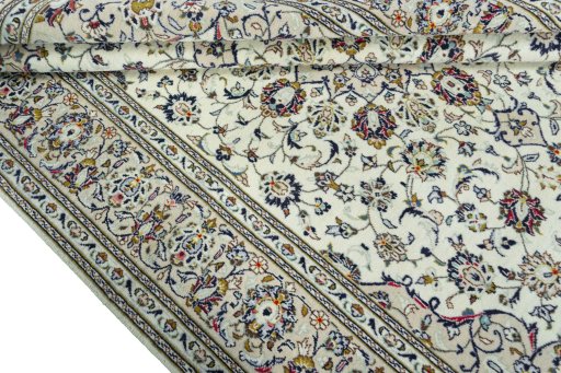 Close-up detail of 2000s Kashan rug from Iran / Persia showing Wool weave