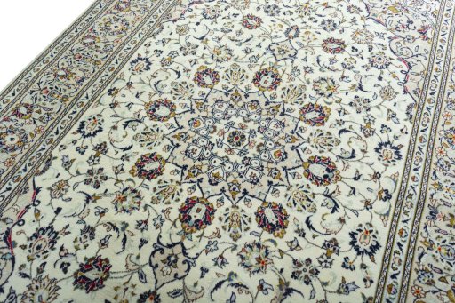 Backside of handmade 2000s Kashan rug showing knot structure and weave density