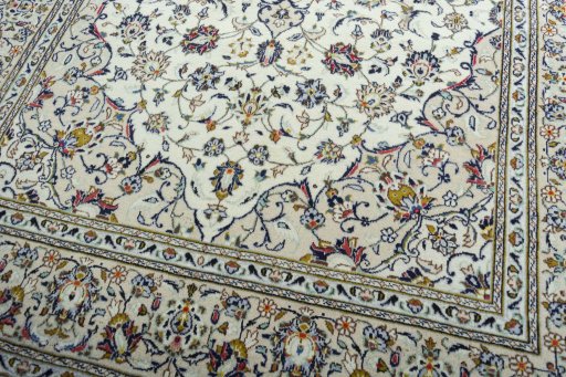 Close-up detail of 2000s Kashan rug from Iran / Persia showing Wool weave
