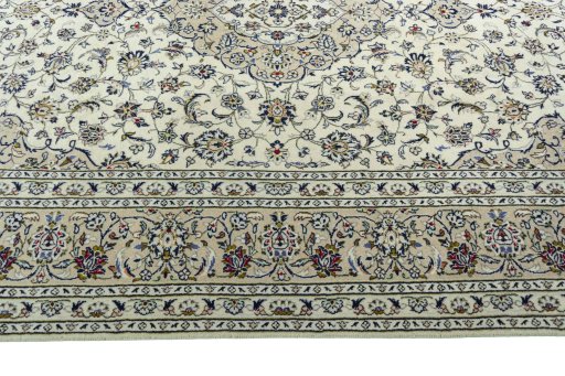 Corner detail of 2000s Kashan rug showing border pattern and Wool pile