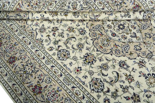 Close-up detail of 2000s Kashan rug from Iran / Persia showing Wool weave