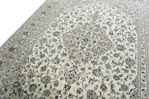 Backside of handmade 2000s Kashan rug showing knot structure and weave density