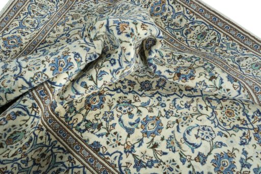 Surface texture of 2000s Kashan rug with natural Wool and intricate pattern