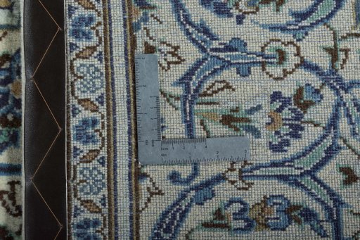 Backside of handmade 2000s Kashan rug showing knot structure and weave density