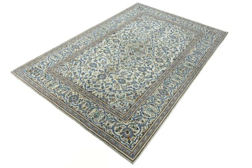 Corner detail of 2000s Kashan rug showing border pattern and Wool pile
