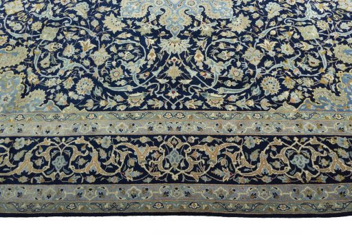 Corner detail of 2000s Kashan rug showing border pattern and Cork pile