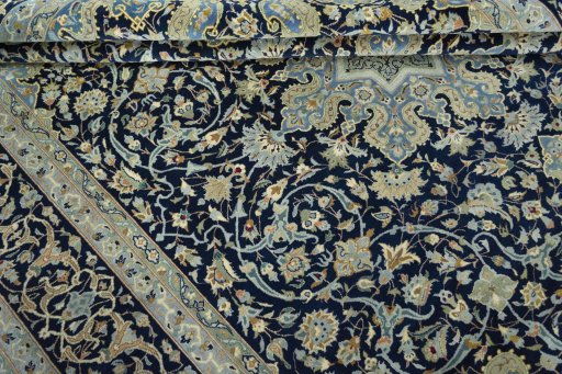Close-up detail of 2000s Kashan rug from Iran / Persia showing Cork weave