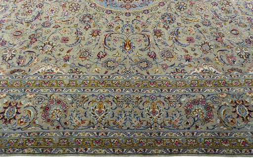 Corner detail of 2000s Kashan rug showing border pattern and Wool pile