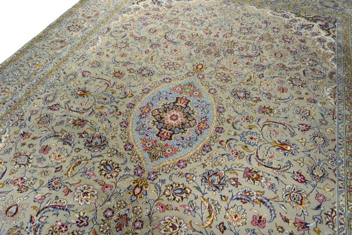 Backside of handmade 2000s Kashan rug showing knot structure and weave density