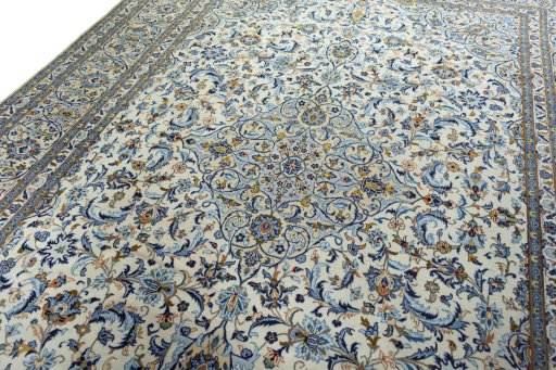 Backside of handmade 2000s Kashan rug showing knot structure and weave density