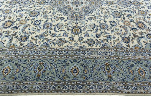 Corner detail of 2000s Kashan rug showing border pattern and Wool pile