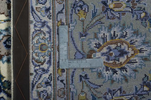Backside of handmade 2000s Kashan rug showing knot structure and weave density