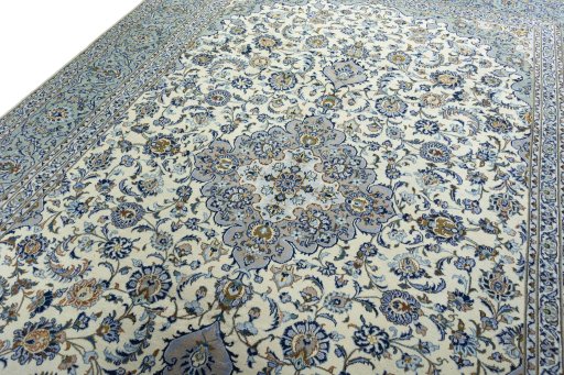 Backside of handmade 2000s Kashan rug showing knot structure and weave density