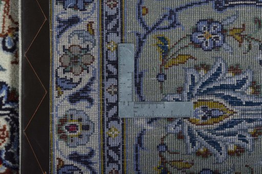 Backside of handmade 2000s Kashan rug showing knot structure and weave density