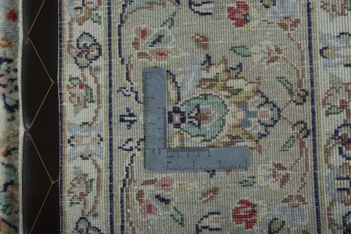 Backside of handmade 2000s Kashan rug showing knot structure and weave density