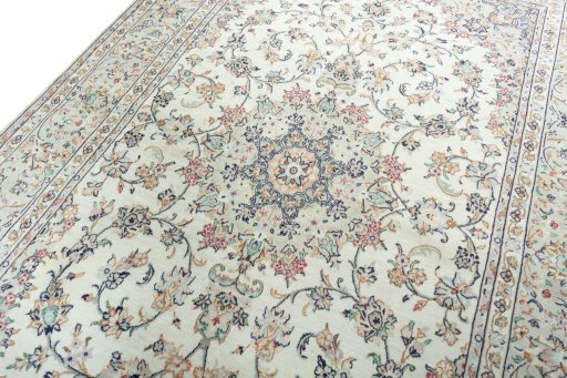 Backside of handmade 2000s Kashan rug showing knot structure and weave density