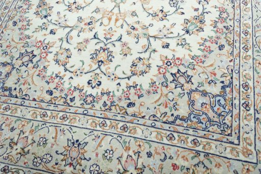 Close-up detail of 2000s Kashan rug from Iran / Persia showing Wool weave
