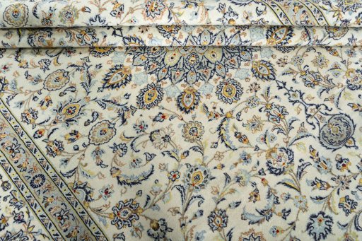 Close-up detail of 2000s Kashan rug from Iran / Persia showing Wool weave