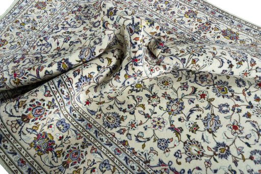 Surface texture of 2000s Kashan rug with natural Wool and intricate pattern