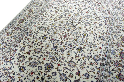 Backside of handmade 2000s Kashan rug showing knot structure and weave density