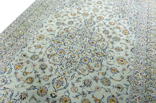 Backside of handmade 1970s Kashan rug showing knot structure and weave density