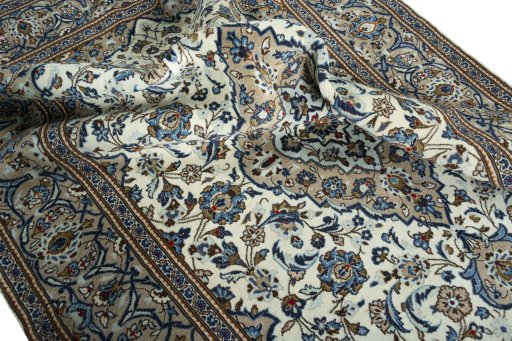 Surface texture of 2000s Kashan rug with natural Wool and intricate pattern