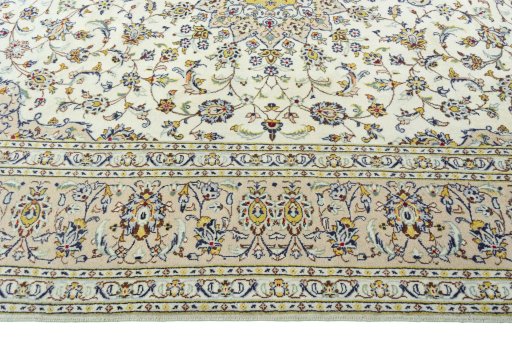 Corner detail of 2000s Kashan rug showing border pattern and Wool pile