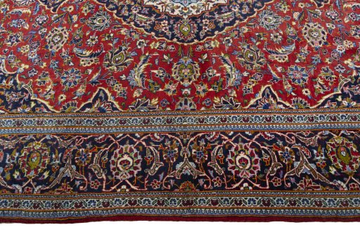 Corner detail of 2000s Kashan rug showing border pattern and Wool pile