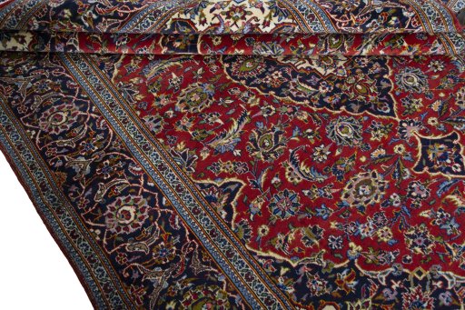 Close-up detail of 2000s Kashan rug from Iran / Persia showing Wool weave