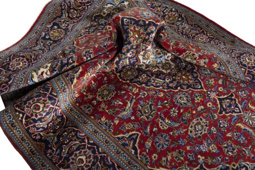 Surface texture of 2000s Kashan rug with natural Wool and intricate pattern