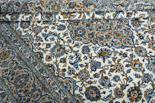 Close-up detail of 2000s Kashan rug from Iran / Persia showing Wool weave