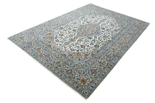 Corner detail of 2000s Kashan rug showing border pattern and Wool pile