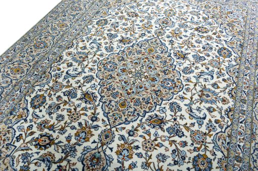 Backside of handmade 2000s Kashan rug showing knot structure and weave density