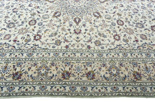 Corner detail of 2000s Kashan rug showing border pattern and Wool pile