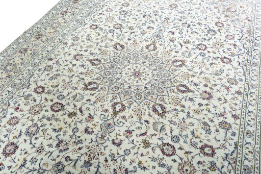 Backside of handmade 2000s Kashan rug showing knot structure and weave density
