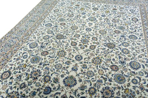 Backside of handmade 2000s Kashan rug showing knot structure and weave density