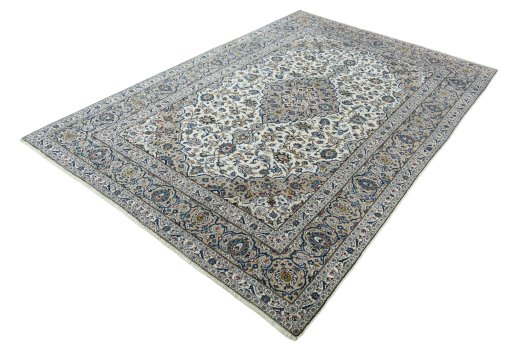 Corner detail of 2000s Kashan rug showing border pattern and Wool pile
