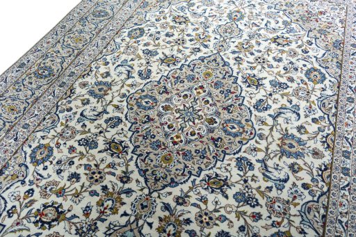 Backside of handmade 2000s Kashan rug showing knot structure and weave density
