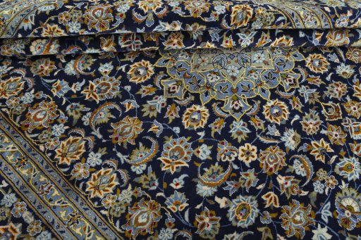 Close-up detail of 2000s Kashan rug from Iran / Persia showing Wool weave
