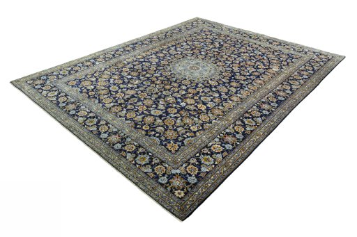 Corner detail of 2000s Kashan rug showing border pattern and Wool pile