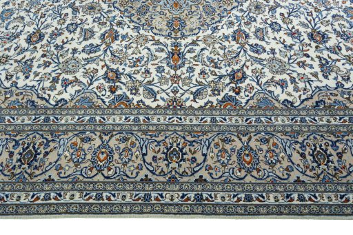 Corner detail of 2000s Kashan rug showing border pattern and Wool pile