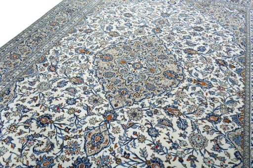 Backside of handmade 2000s Kashan rug showing knot structure and weave density