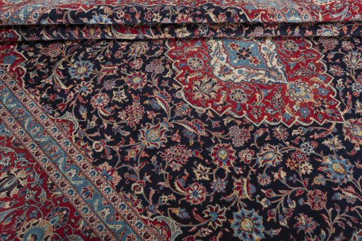Close-up detail of 2000s Kashan rug from Iran / Persia showing Wool weave