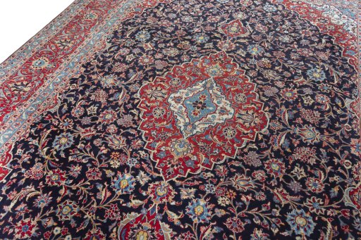 Backside of handmade 2000s Kashan rug showing knot structure and weave density