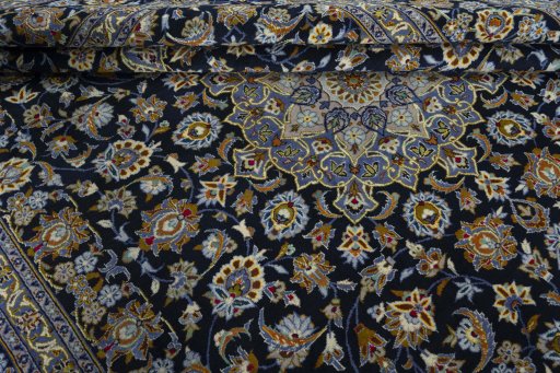 Close-up detail of 2000s Kashan rug from Iran / Persia showing Wool weave