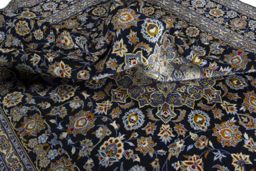 Surface texture of 2000s Kashan rug with natural Wool and intricate pattern