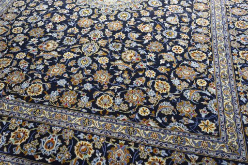 Close-up detail of 2000s Kashan rug from Iran / Persia showing Wool weave